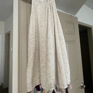 flowing tank top with colorful pompoms at the end